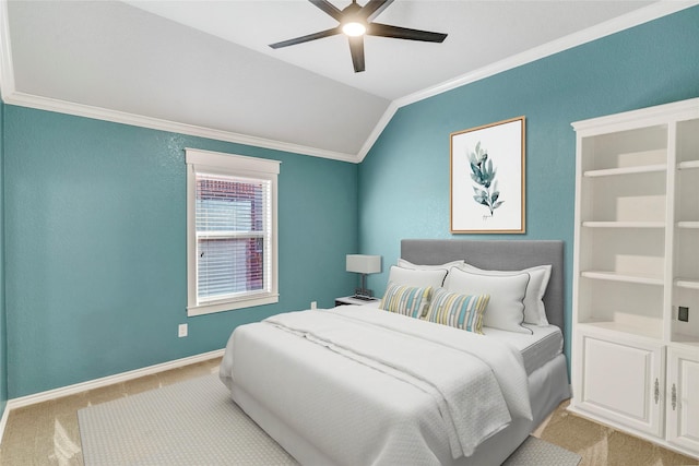 bedroom featuring lofted ceiling, crown molding, light colored carpet, and ceiling fan