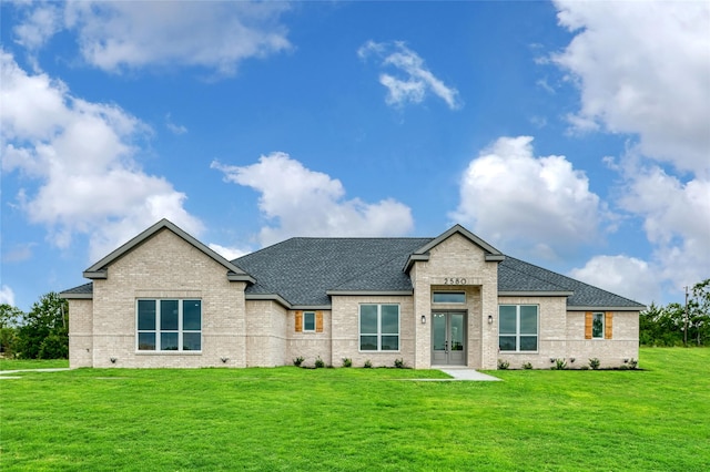 view of front of home featuring french doors and a front yard