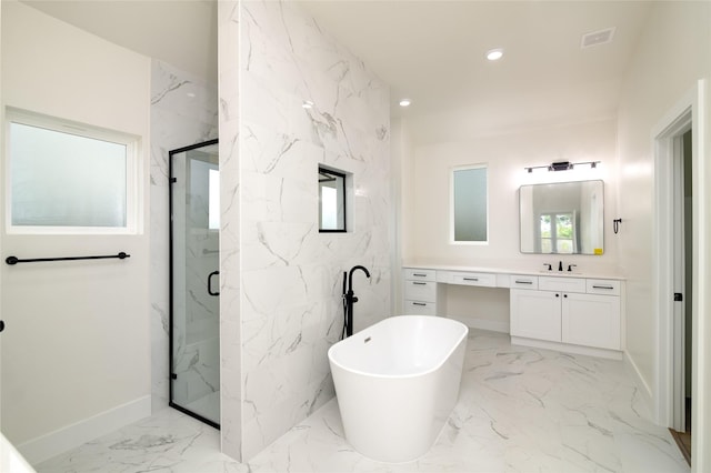full bathroom with a marble finish shower, a freestanding bath, baseboards, marble finish floor, and vanity