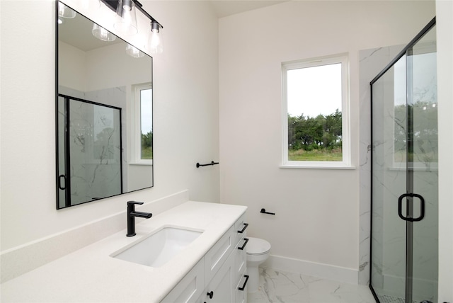 bathroom featuring vanity, toilet, and a shower with shower door