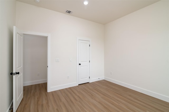 unfurnished bedroom with wood-type flooring