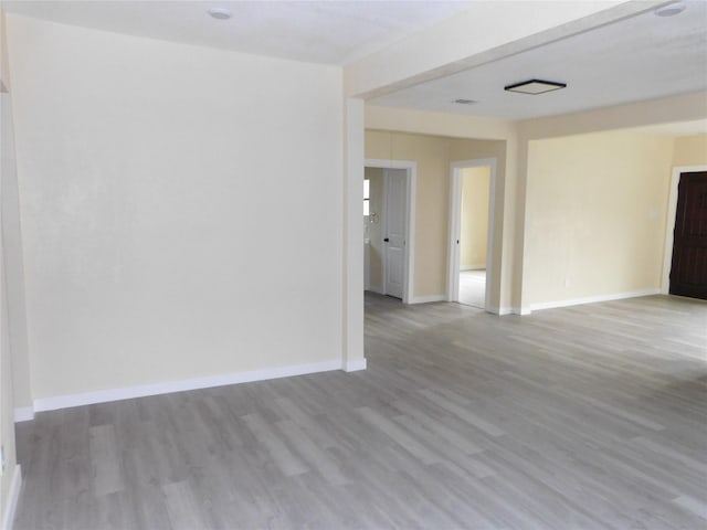 empty room with hardwood / wood-style flooring