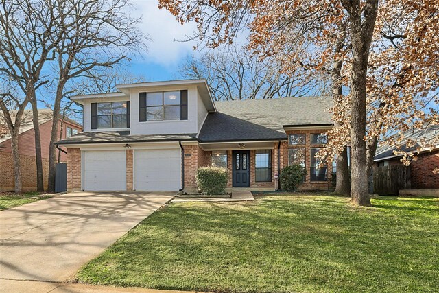 view of front of property featuring a front yard and a garage