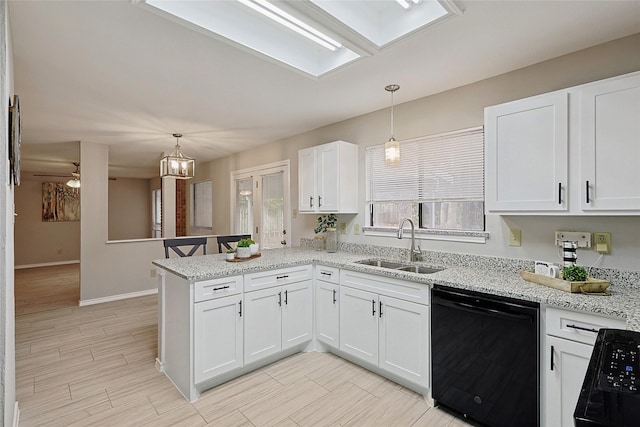 kitchen with white cabinetry, black dishwasher, sink, and kitchen peninsula