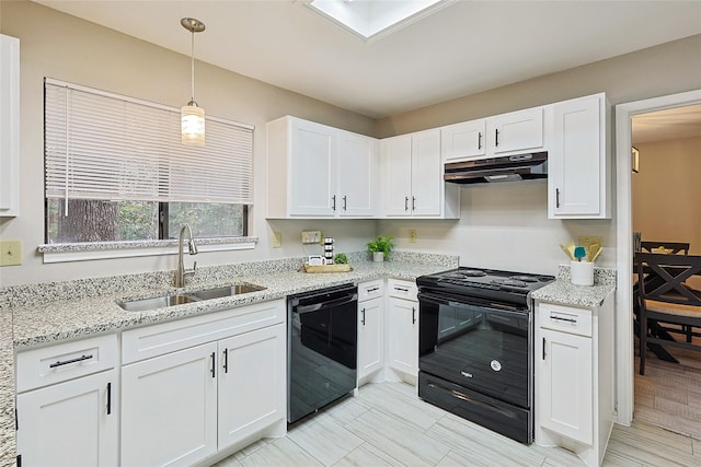 kitchen featuring white cabinetry, sink, pendant lighting, and black appliances