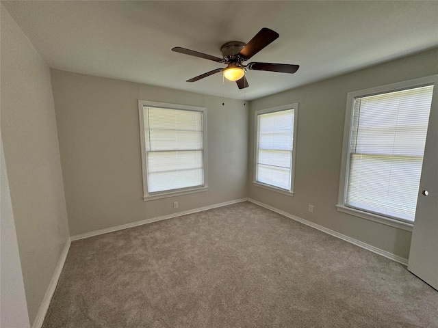 carpeted empty room with ceiling fan