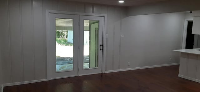 doorway to outside with dark wood-type flooring