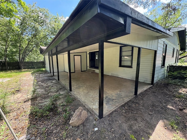 view of property exterior with a patio