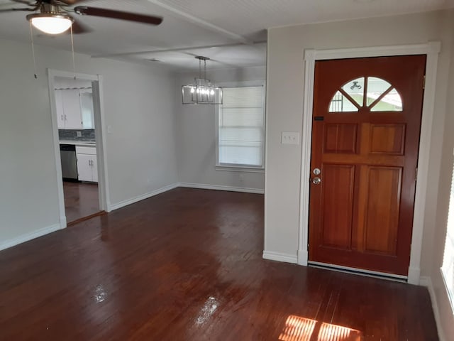 foyer featuring an inviting chandelier and dark hardwood / wood-style floors