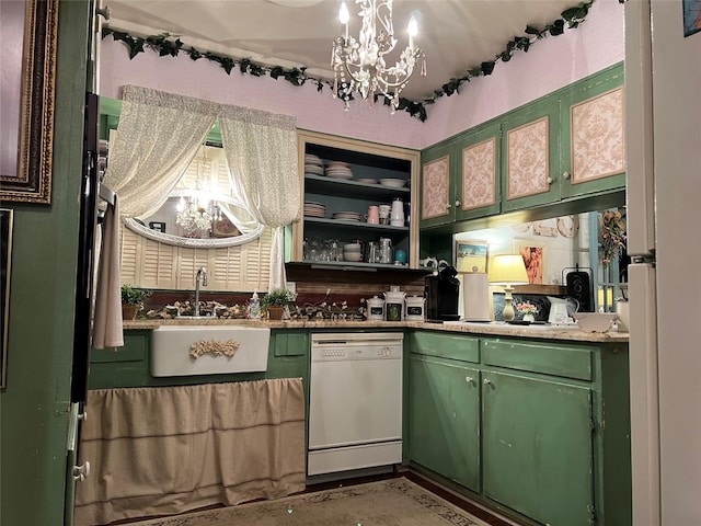 kitchen with a notable chandelier, green cabinetry, white dishwasher, and sink