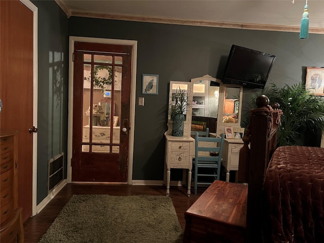 bedroom featuring dark hardwood / wood-style flooring