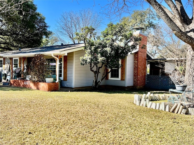 view of home's exterior with a yard