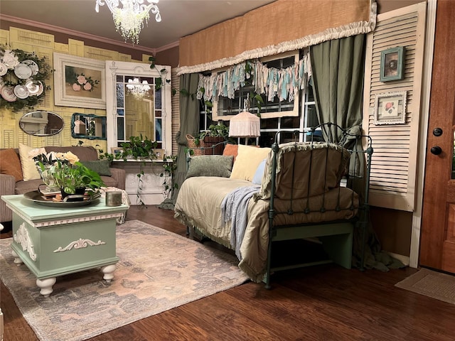 bedroom featuring dark hardwood / wood-style floors, radiator heating unit, crown molding, and a notable chandelier