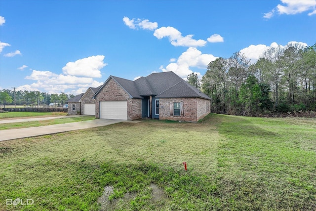 view of front of property featuring a garage and a front lawn