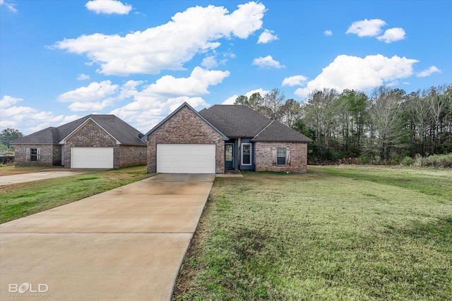 view of front of home featuring a front yard and a garage