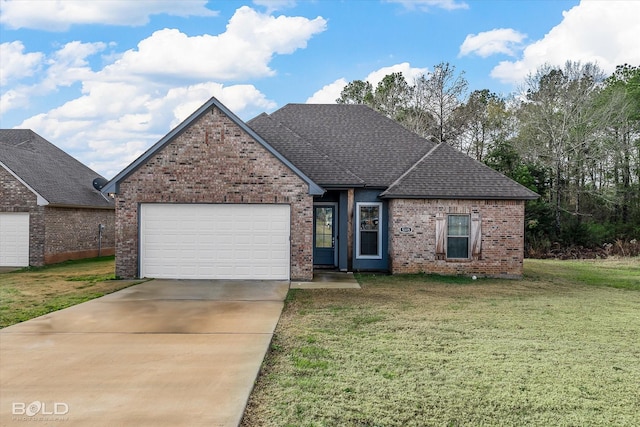 view of front of home with a garage and a front yard