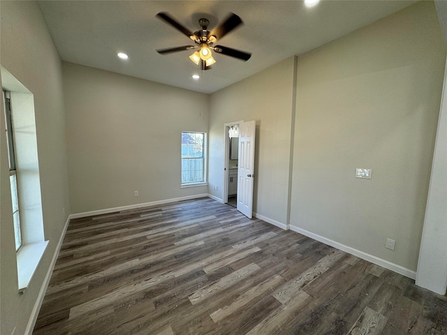 unfurnished bedroom featuring ceiling fan and dark wood-type flooring