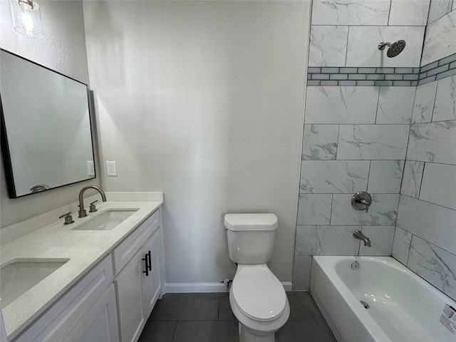 full bathroom featuring tile patterned floors, toilet, vanity, and tiled shower / bath