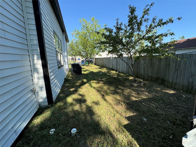 view of yard with central AC unit