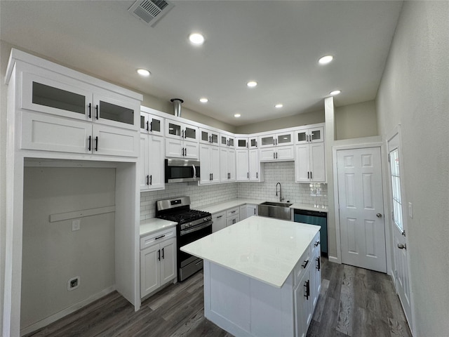 kitchen featuring white cabinetry, sink, and appliances with stainless steel finishes