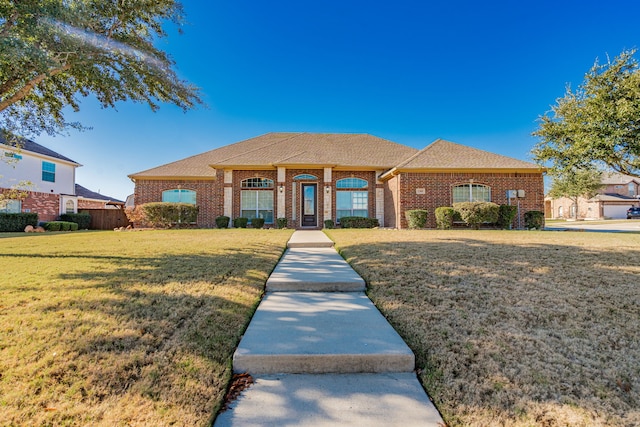 ranch-style house with a front lawn