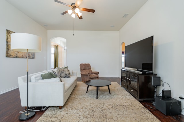 living room featuring hardwood / wood-style flooring and ceiling fan