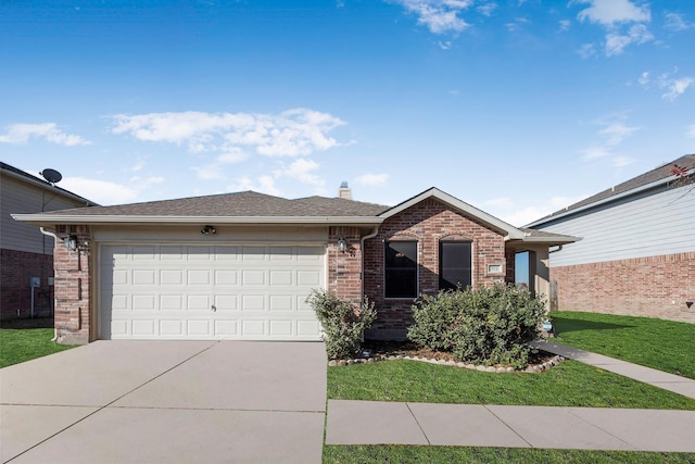 ranch-style house featuring concrete driveway, a chimney, an attached garage, a front lawn, and brick siding