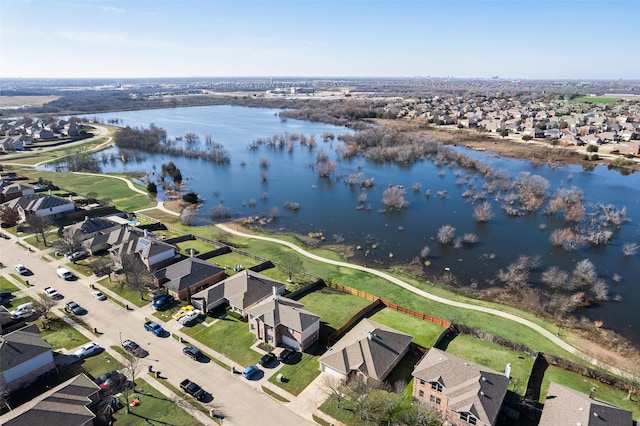 birds eye view of property featuring a residential view and a water view