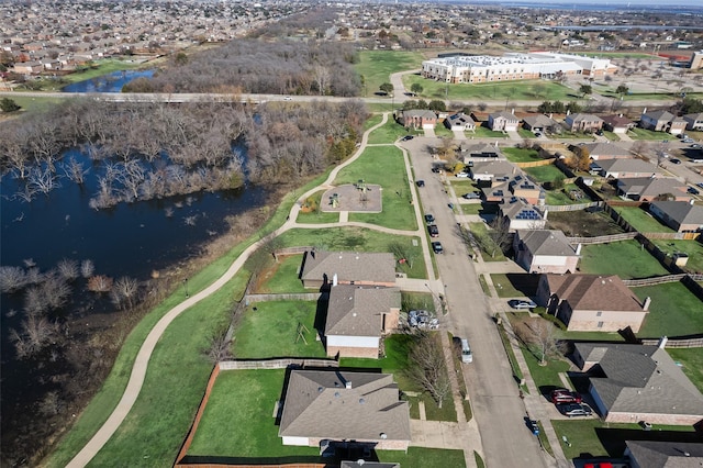 birds eye view of property with a water view and a residential view