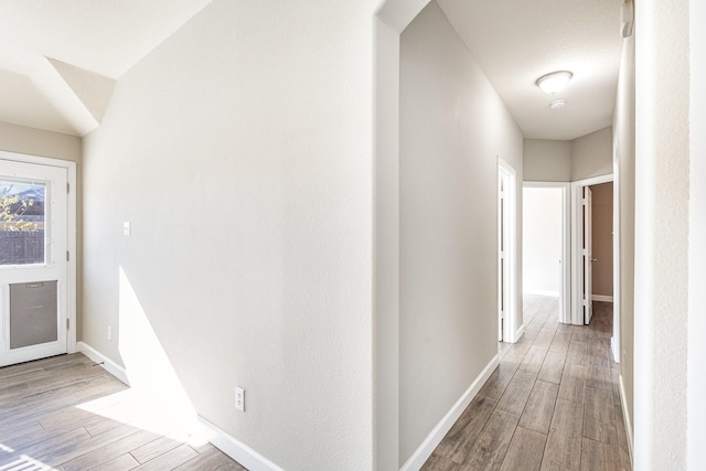 hall with wood-type flooring