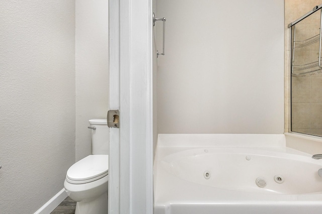 bathroom featuring toilet and a bathing tub