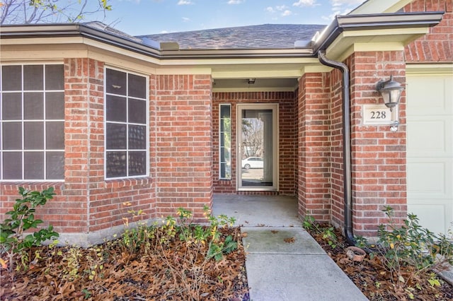 view of exterior entry featuring a garage