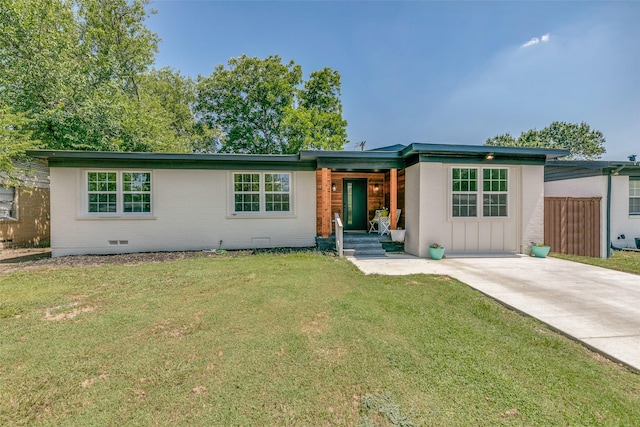 ranch-style home with a front lawn