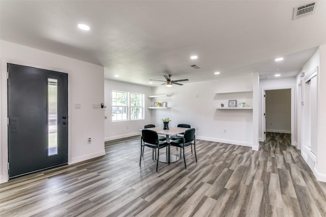 dining area with hardwood / wood-style flooring and ceiling fan