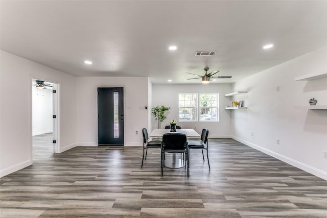 dining room featuring ceiling fan and dark hardwood / wood-style floors