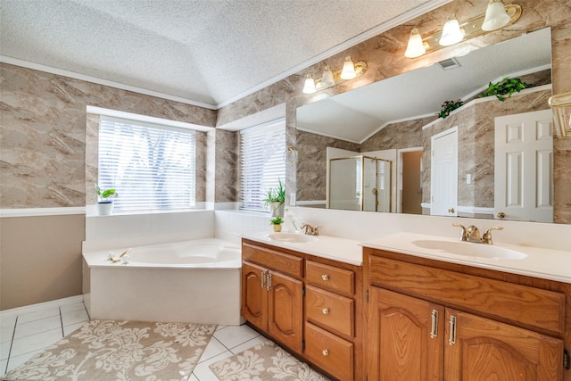 bathroom with tile patterned flooring, shower with separate bathtub, vanity, and lofted ceiling