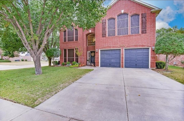 view of front of property with a garage and a front lawn