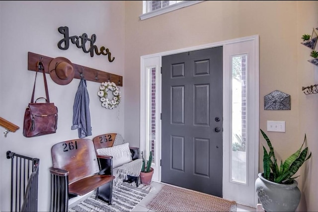 entryway featuring tile patterned floors and plenty of natural light