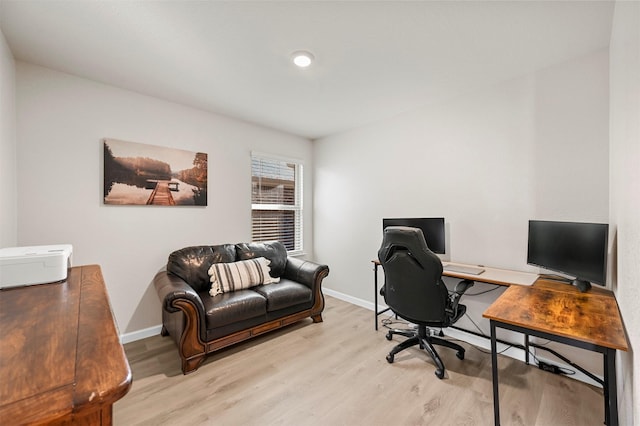 office with light wood-type flooring