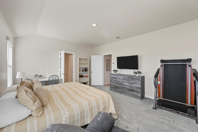 carpeted bedroom with lofted ceiling