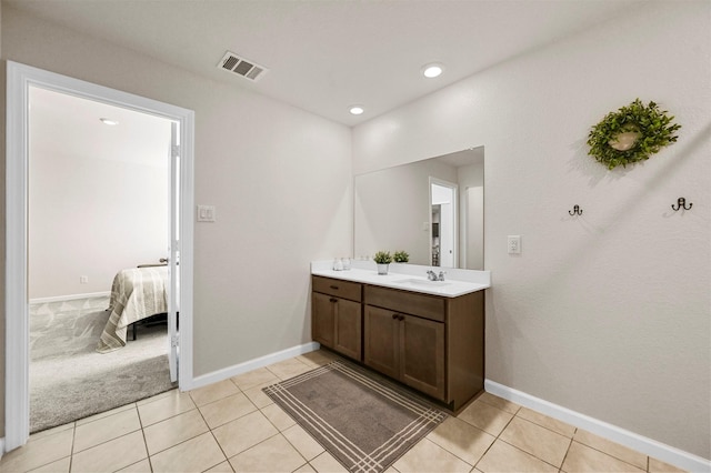 bathroom featuring tile patterned flooring and vanity