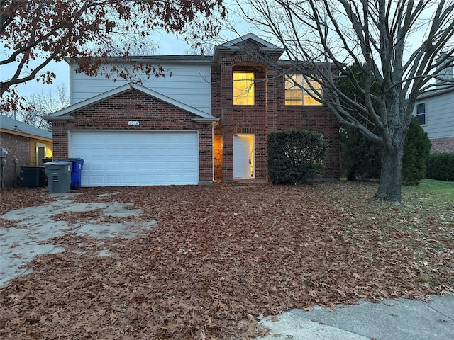 view of property featuring central AC and a garage