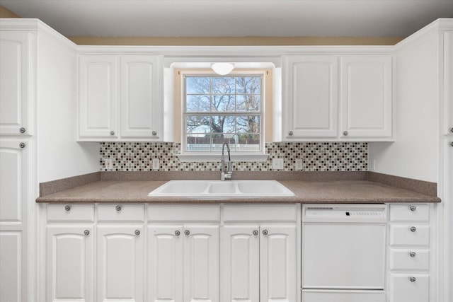 kitchen with sink, white cabinets, and white dishwasher