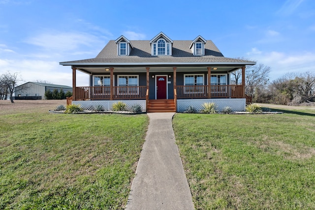 view of front of home with a front yard and covered porch