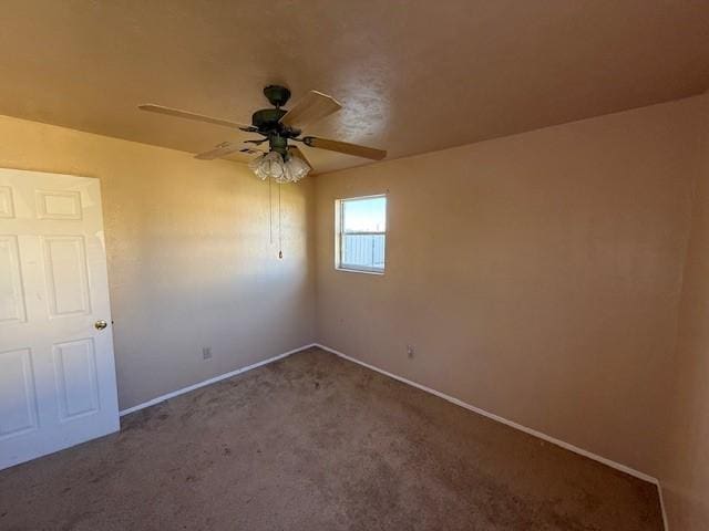 carpeted empty room with ceiling fan