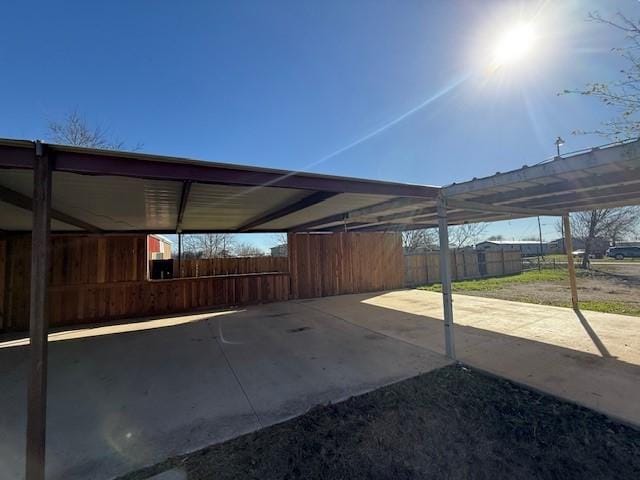 view of parking with a carport