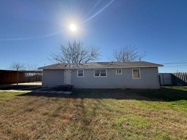 back of house with a yard