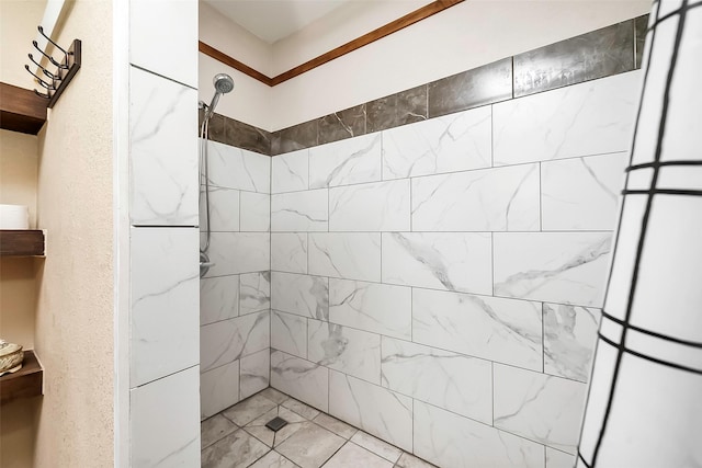 bathroom with a tile shower