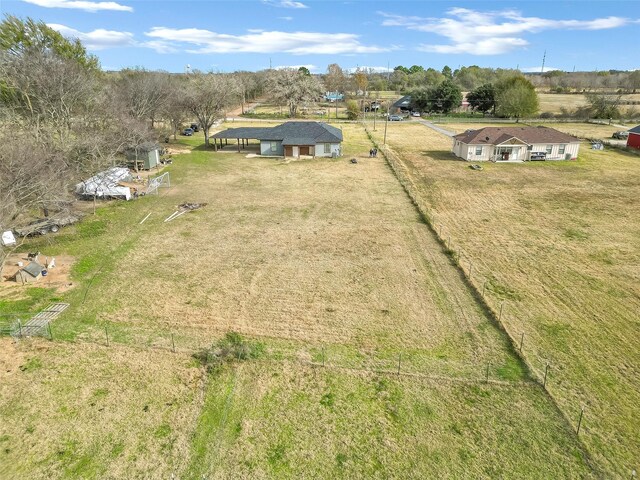 birds eye view of property featuring a rural view