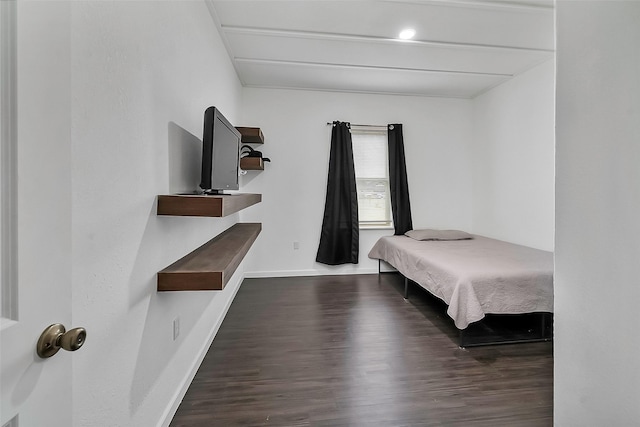 bedroom featuring dark wood-type flooring